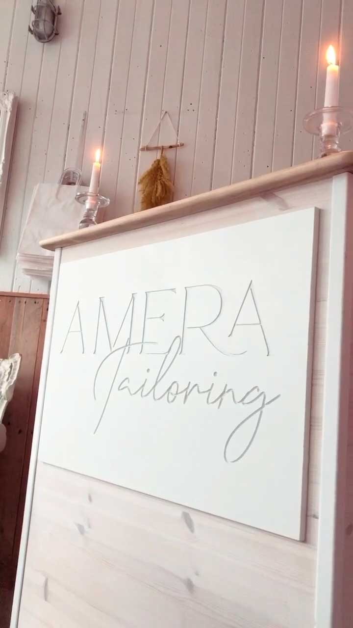 Amera Tailoring sign in the shop